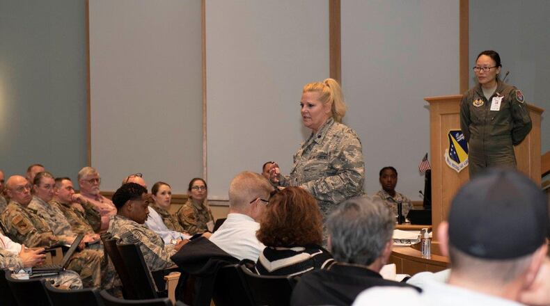 Lt. Col. Karen Kramer, 88th Aerospace Medicine Squadron’s Public Health Flight commander, center, briefs the audience during a COVID-19 tabletop exercise on March 11 inside the Wright-Patterson Medical Center auditorium while Lt. Col. (Dr.) Hui Ling Li, installation public health emergency officer and 88 MDG chief of Aerospace Medicine, stands by. (U.S. Air Force photo/Senior Airman Emily Rupert)