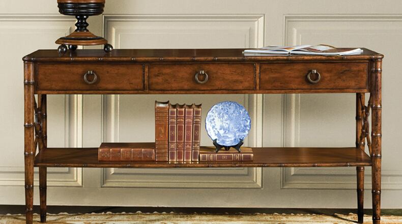 While the top of the table needs to be pretty clear to not obstruct the view of the TV, take advantage of the space below for a display or storage. (Mary Carol Garrity/TNS)