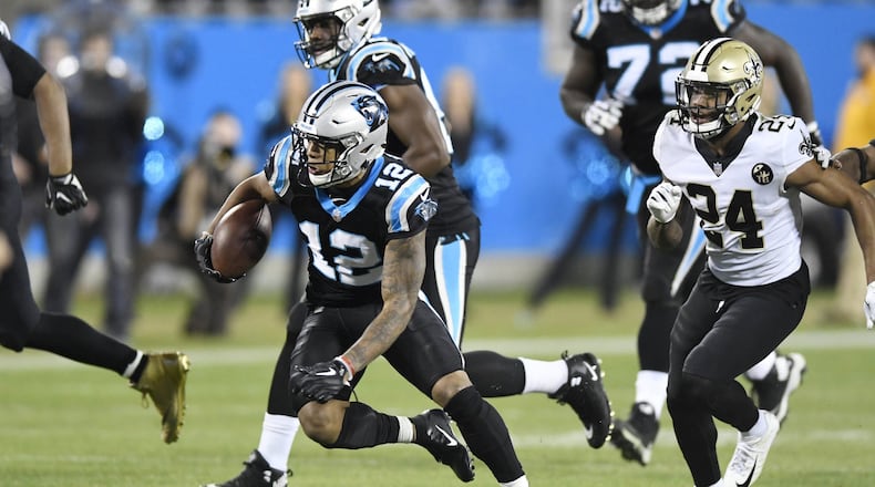 Carolina Panthers wide receiver D.J. Moore (12) runs past New Orleans Saints strong safety Vonn Bell (24) during the second half at Bank of America Stadium in Charlotte, N.C., on Monday, Dec. 17, 2018. The Saints won, 12-9. (David T. Foster III/Charlotte Observer/TNS)