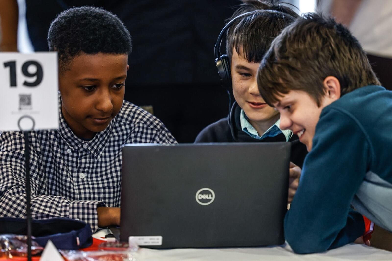 Dayton Stem School students from left, Noah Negassi, Jayden Clark and Liam Urbaniak play a game before the regional Flexfactor competition held at Sinclair College Friday April 19, 2024. The FlexFactor program is a collaborative technology and entrepreneurship program funded by the department of defense, that allows youth to discover the value of a career in advanced manufacturing. JIM NOELKER/STAFF