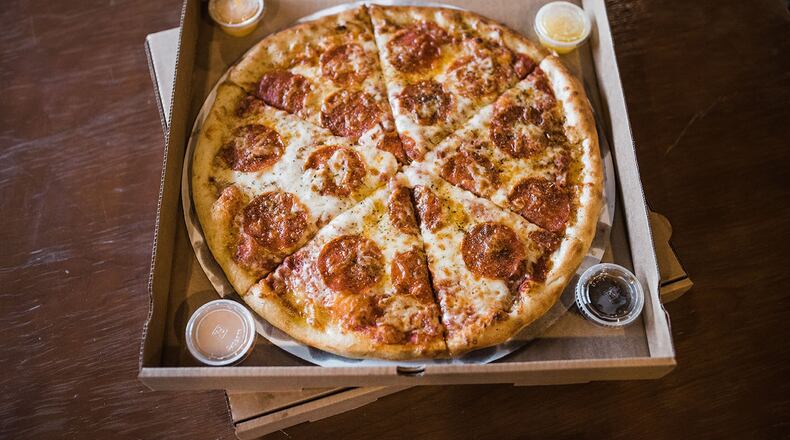 The Great Charity Pizza Catering Auction held at The Yellow Cab Tavern on at 1 p.m. today will give attendees the opportunity to bid on pizza, pizza box art and Pizza Bandit catering packages, with all proceeds benefiting The Foodbank Inc. CONTRIBUTED/CHELSEA HALL