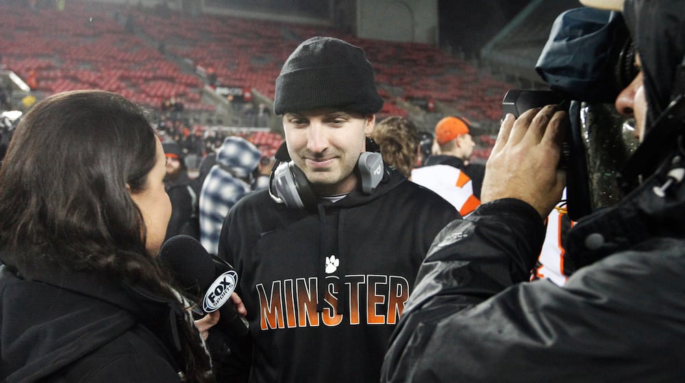 Minster coach Geron Stokes gives a postgame interview after beating Kirtland in the Division VI state championship football game on Friday, Dec. 5, 2014, at Ohio Stadium in Columbus.