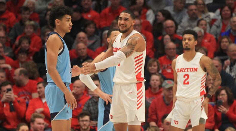 Dayton's Obi Toppin smiles as he guards brother Jacob, left, of Rhode Island, in the first half on Tuesday, Feb. 11, 2020, at UD Arena.