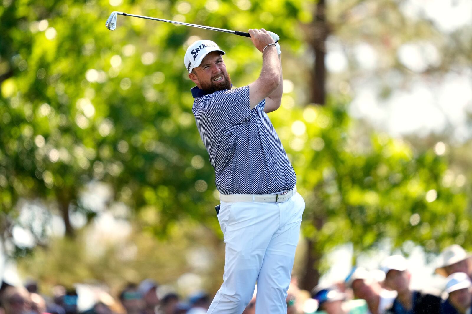 Shane Lowry, of Ireland, watches his tee shot on the fourth hole during the second round at the Masters golf tournament, Friday, April 11, 2025, in Augusta, Ga. (AP Photo/Julia Demaree Nikhinson)