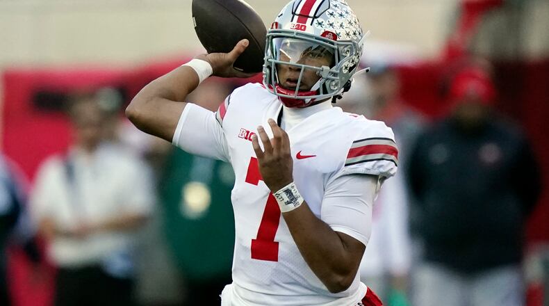 Ohio State quarterback C.J. Stroud throws during the first half of an NCAA college football game against Michigan State, Saturday, Oct. 8, 2022, in East Lansing, Mich. (AP Photo/Carlos Osorio)