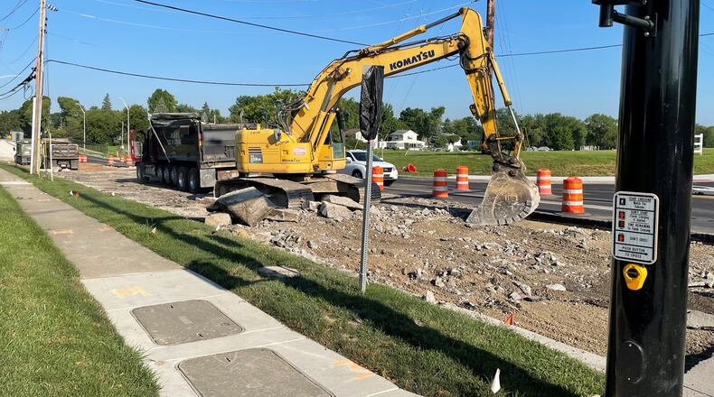 Work to improve Forrer Boulevard from Woodman Drive to Smithville Road in Kettering continued Thursday as part of $2.473 million contract awarded to Barrett Paving Inc. The project was budgeted at $1.975 million, but Barrett had the lowest of four bids as costs for municipal capital improvement projects have increased sharply. NICK BLIZZARD/STAFF
