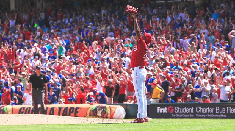 Reds closer Raisel Iglesias celebrates after the final out of a victory against the Cubs on Sunday, June 24, 2018, at Great American Ball Park in Cincinnati. David Jablonski/Staff