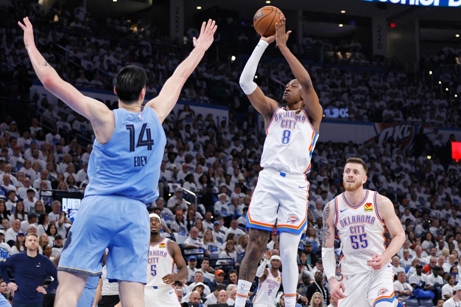 Oklahoma City Thunder forward Jalen Williams (8) looks to shoot over Memphis Grizzlies center Zach Edey (14) as Thunder center Isaiah Hartenstein (55) looks on during the first half in Game 1 of an NBA first-round playoff series, Sunday, April 20, 2025, in Oklahoma City. (AP Photo/Nate Billings)
