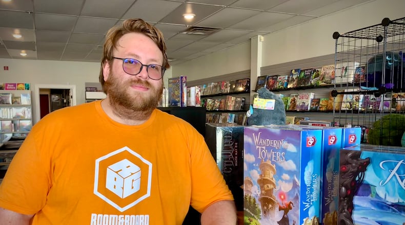Justin Schotz and his wife Jordan recently opened Room and Board Gaming on Maple Avenue in Fairborn. LONDON BISHOP/STAFF