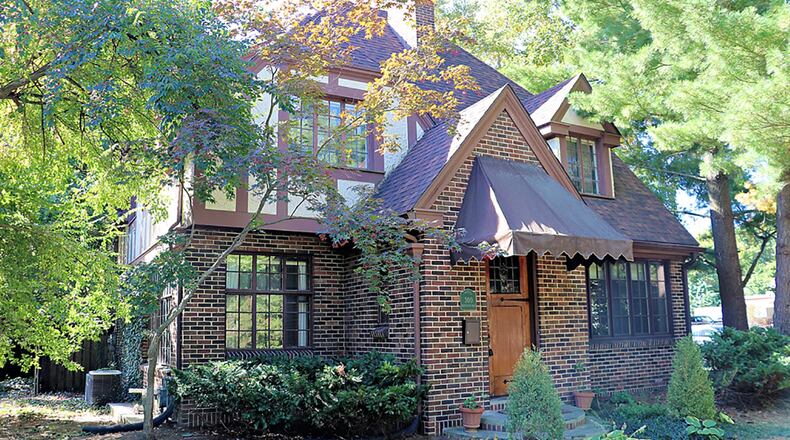 The brick Tudor-style home has about 2,060 sq. ft. of living space plus a finished basement and flexible third-floor space. CONTRIBUTED PHOTO BY KATHY TYLER