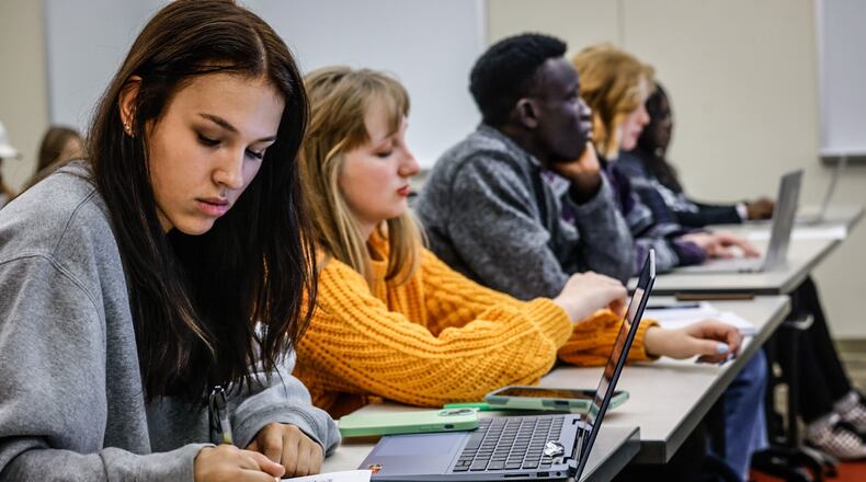 Wright State University student Victoria Farmer, left, takes notes during class Friday September 15, 2023. Wright State has a significant increase in enrollment this year, especially among first-time students. JIM NOELKER/STAFF