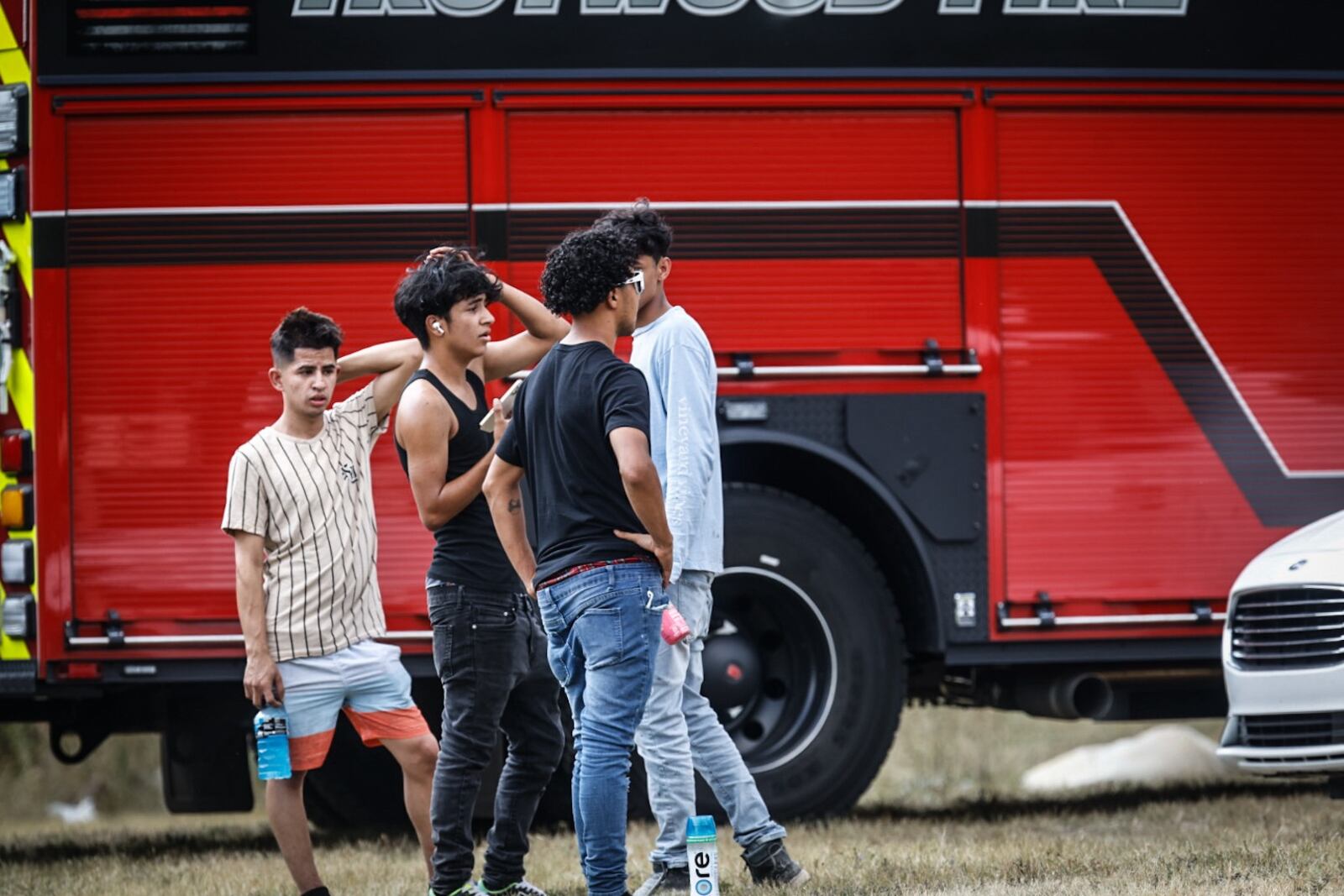 Friends of the young man that is missing at Madison Lakes Park gather in the parking lot. Jim Noelker/Staff