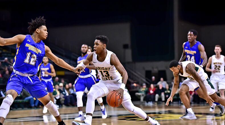 Wright State freshman Malachi Smith drives against a Morehead State player during a game earlier this season. Joseph Craven/CONTRIBUTED