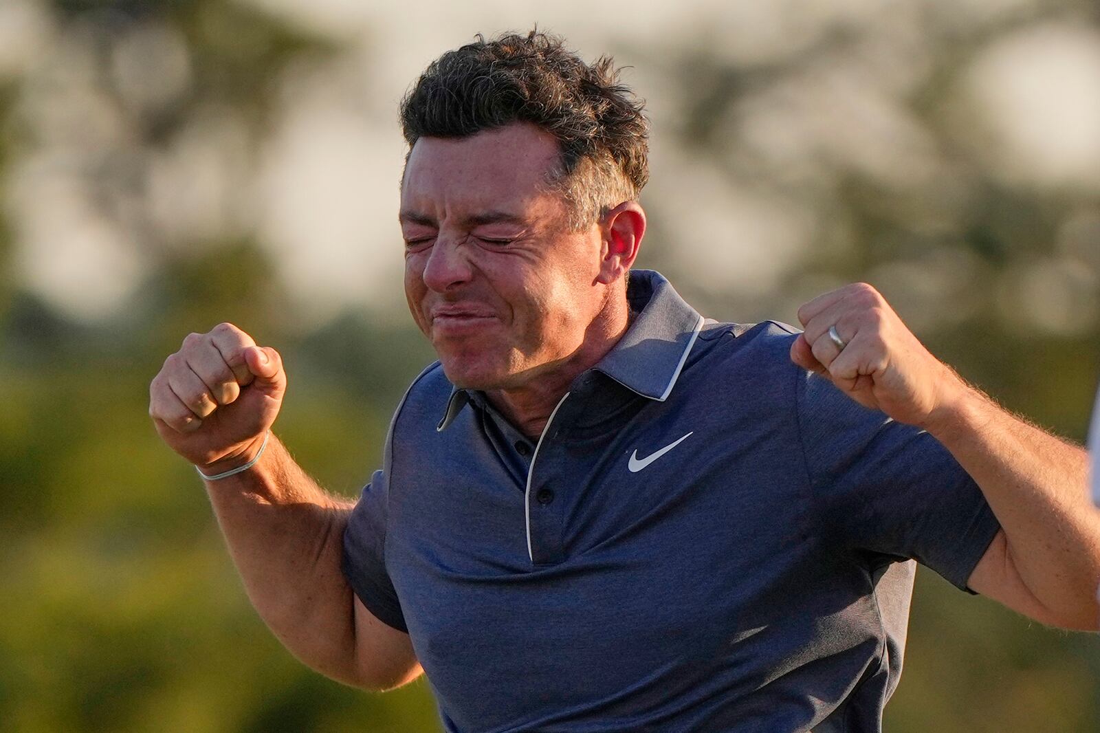 Rory McIlroy, of Northern Ireland, celebrates winning in a playoff against Justin Rose, of England, after the final round the Masters golf tournament, Sunday, April 13, 2025, in Augusta, Ga. (AP Photo/David J. Phillip)