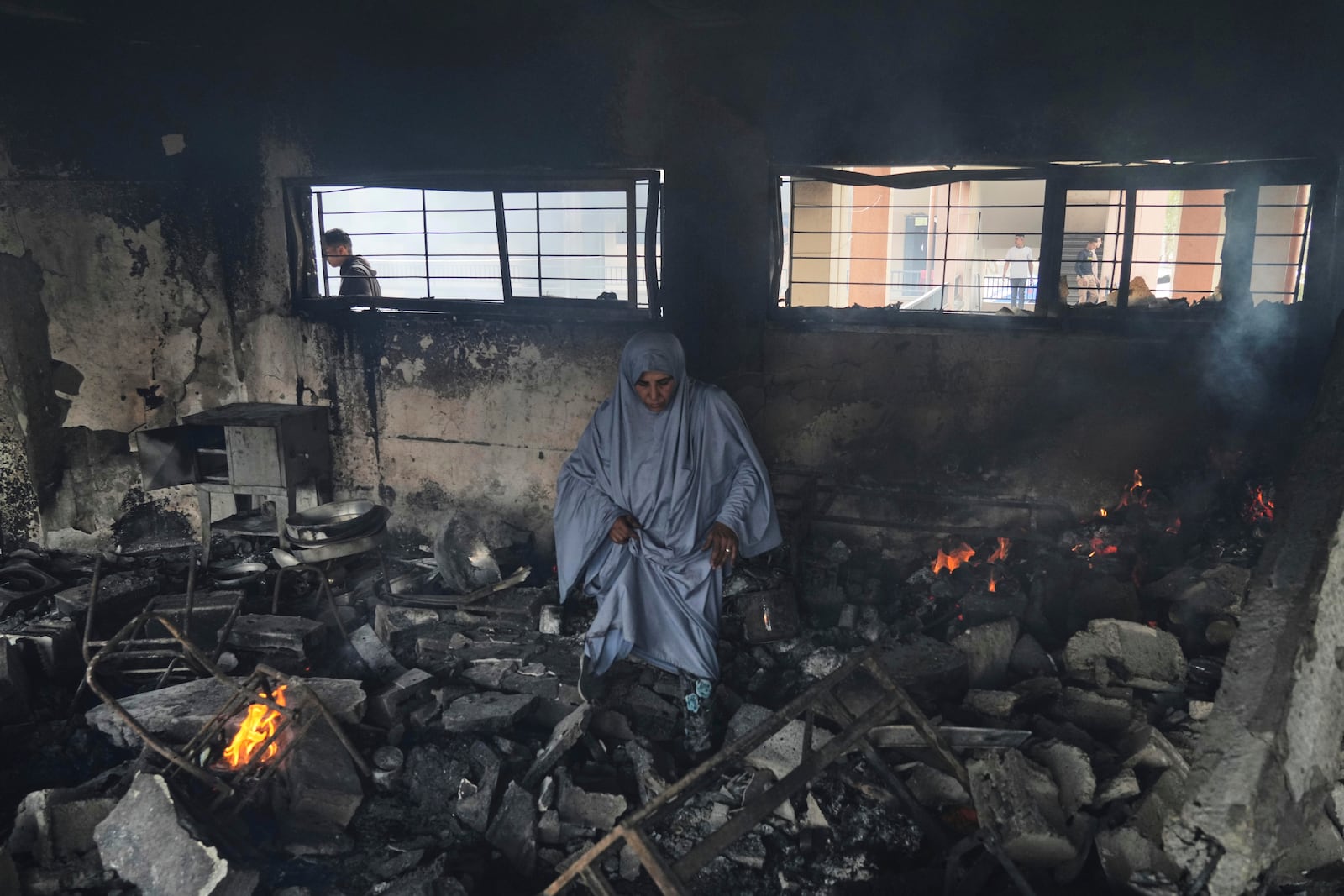 Palestinians inspect the damage after an Israeli army airstrike on Yaffa School, in Gaza City, Wednesday, April 23, 2025. (AP Photo/Jehad Alshrafi)