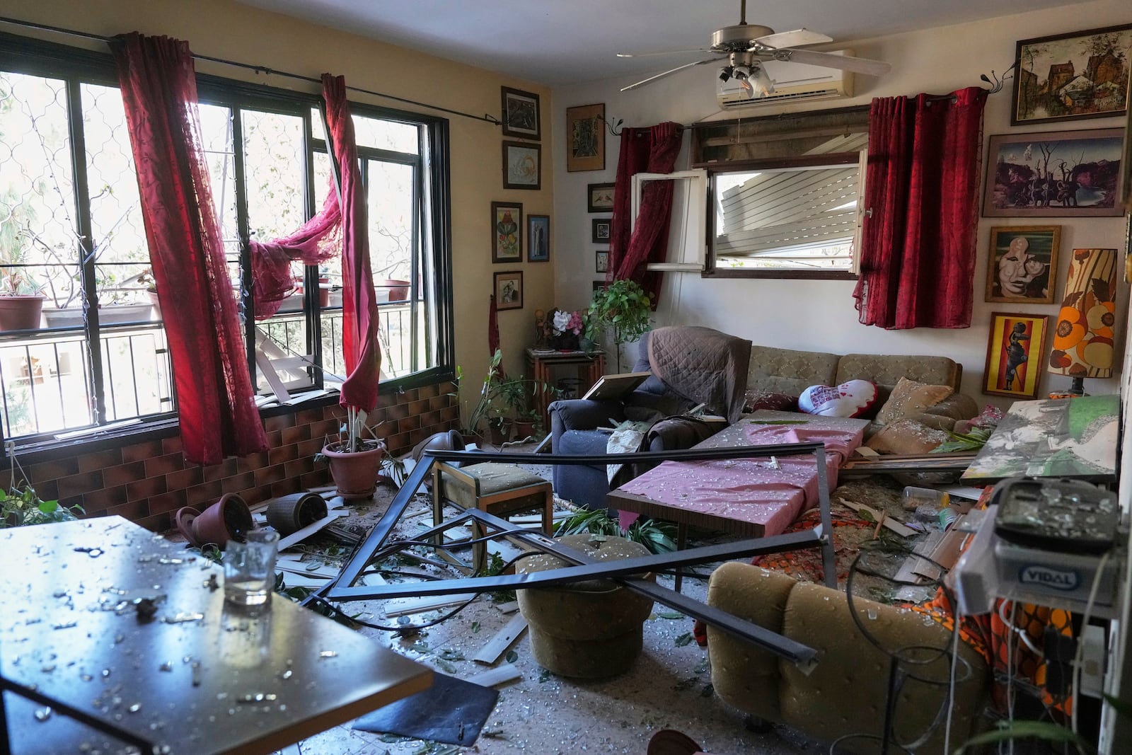 A damaged apartment is seen near the site where an Iranian missile struck in Haifa, Israel, Monday, June 16, 2025. (AP Photo/Ariel Schalit)
