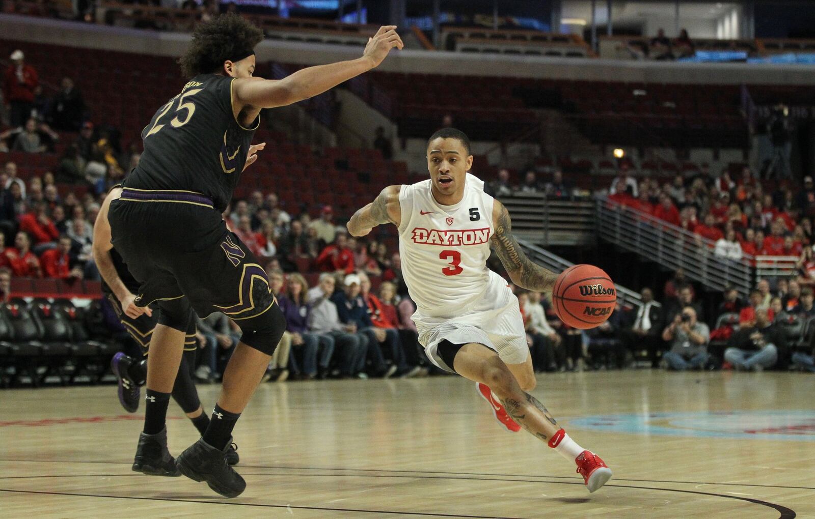 Dayton’s Kyle Davis drives to the basket against Northwestern last December at the United Center in Chicago. DAVID JABLONSKI / STAFF