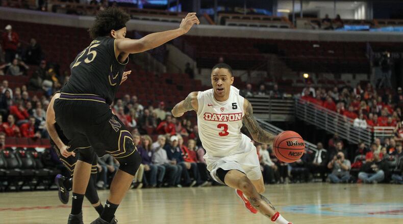 Dayton’s Kyle Davis drives to the basket against Northwestern last December at the United Center in Chicago. DAVID JABLONSKI / STAFF