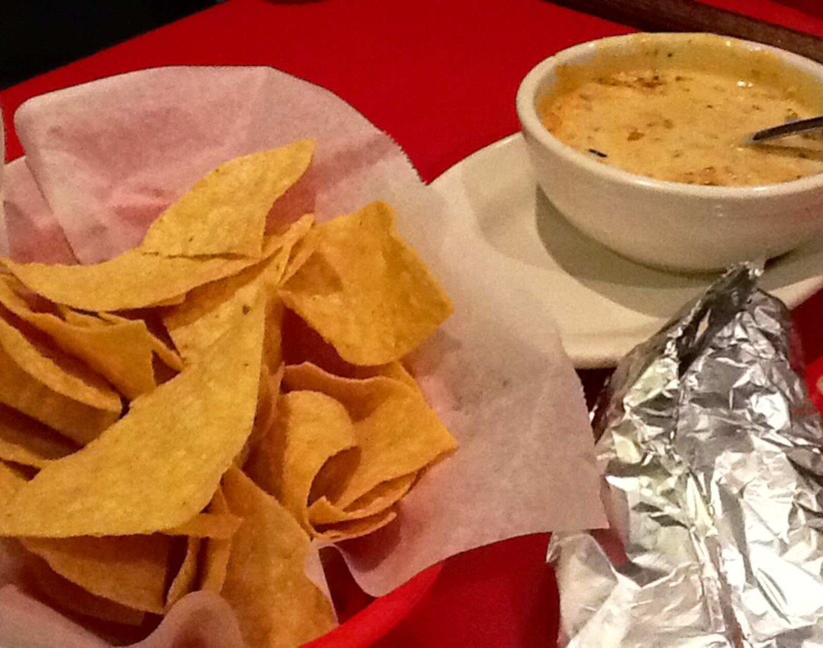 Chori-queso: a delicious dip made from creamy cheese mixed with Mexican chorizo, with peppers and onions.