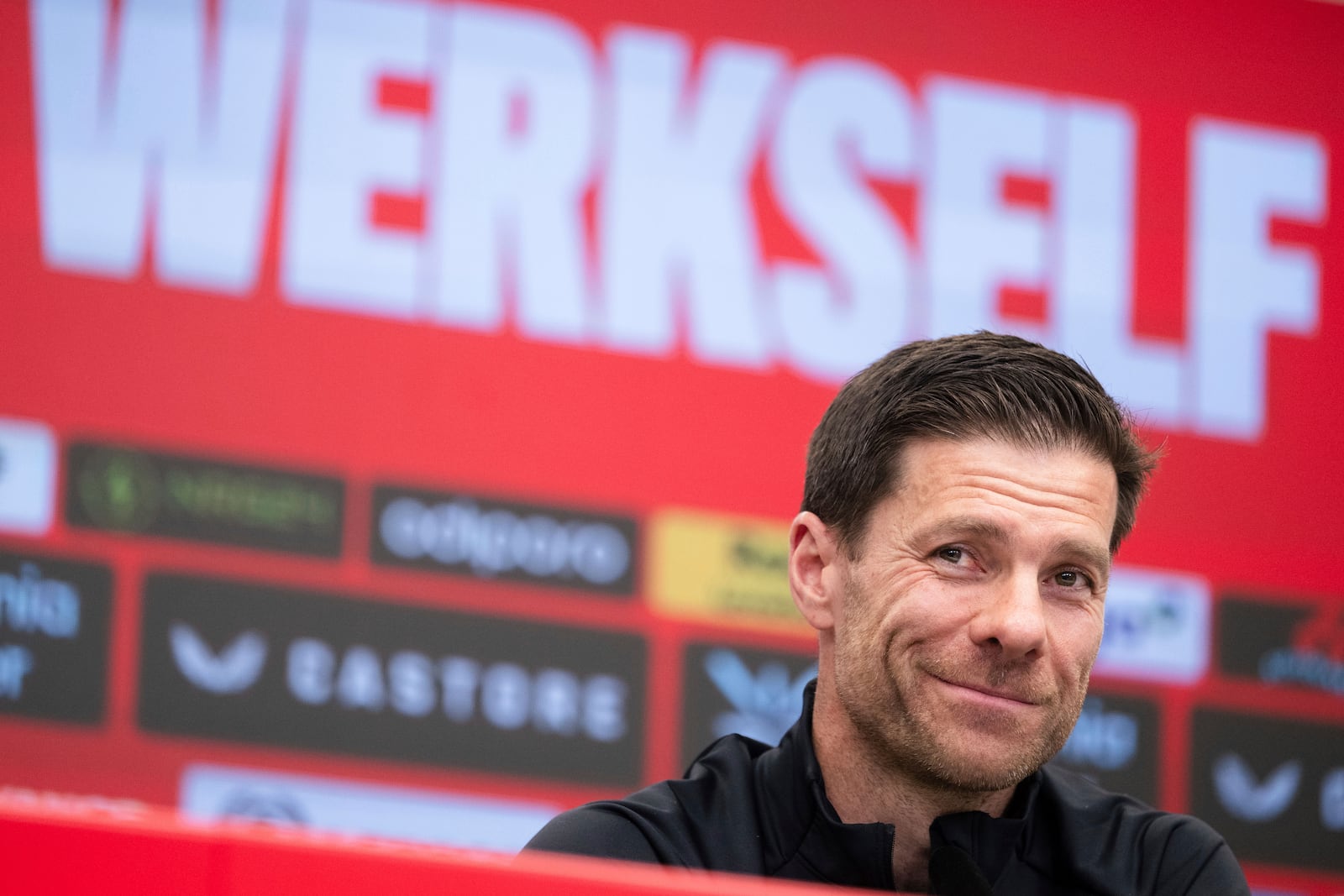 Leverkusen's coach Xabi Alonso attends a press conference in Leverkusen, Germany, Friday, May 9, 2025. (Marius Becker/dpa via AP)