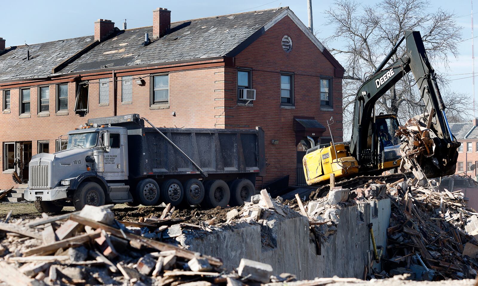 Demolition continues Friday, Feb. 28, 2025 at the DeSoto Bass apartments in West Dayton. MARSHALL GORBY\STAFF