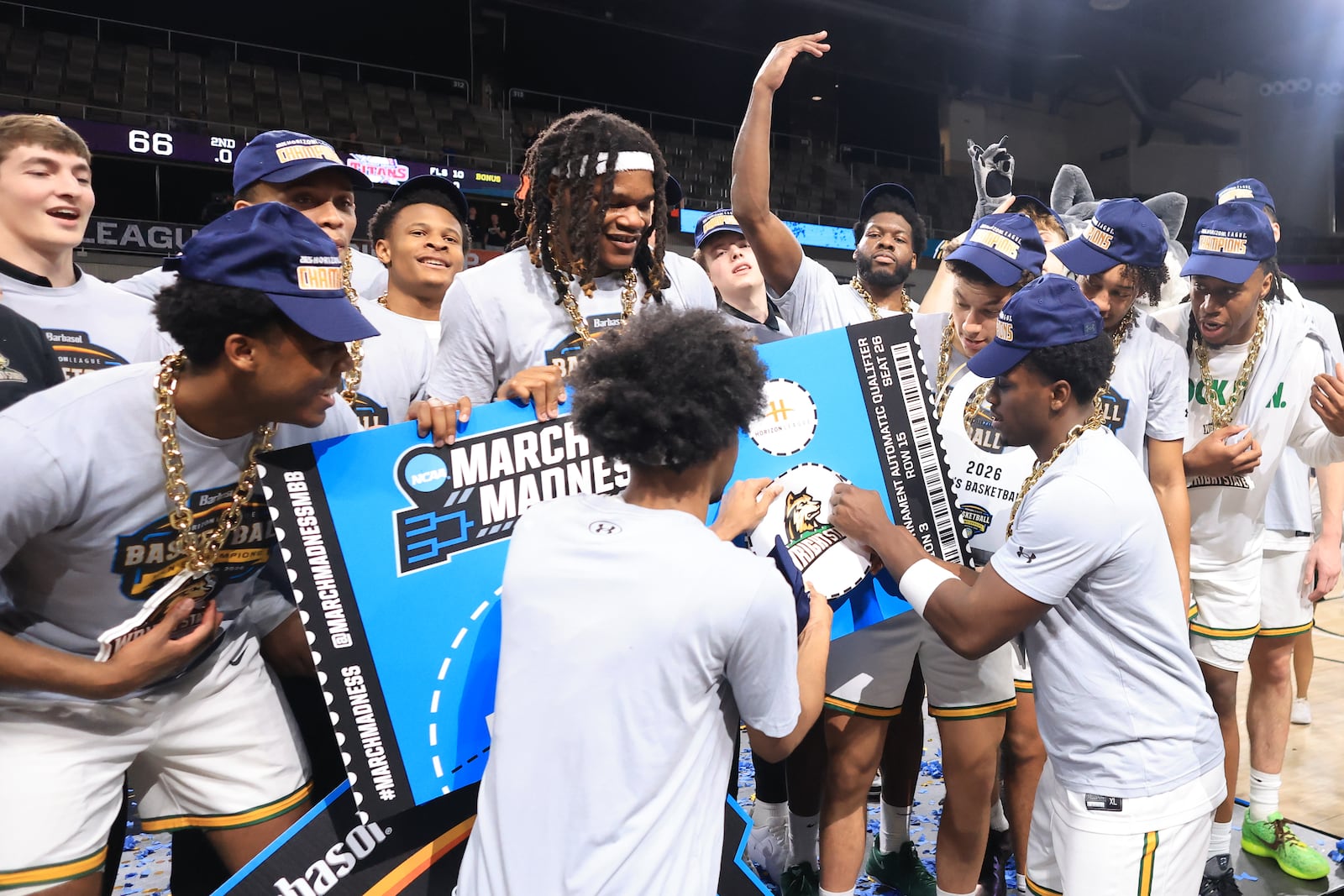 The Wright State University men's basketball team adds their logo to a March Madness ticket after their 66-63 victory over Detroit Mercy in the Horizon League tournament final on Tuesday, March 10, 2026 at Corteva Coliseum in Indianapolis. HORIZON LEAGUE / CONTRIBUTED PHOTO