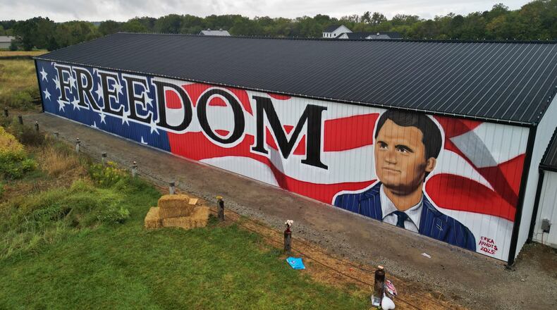 Artist Erica Arndts created a mural in honor of slain activist Charlie Kirk on the side of a barn along Township Line Road near Ohio 73 near Waynesville. NICK GRAHAM/STAFF