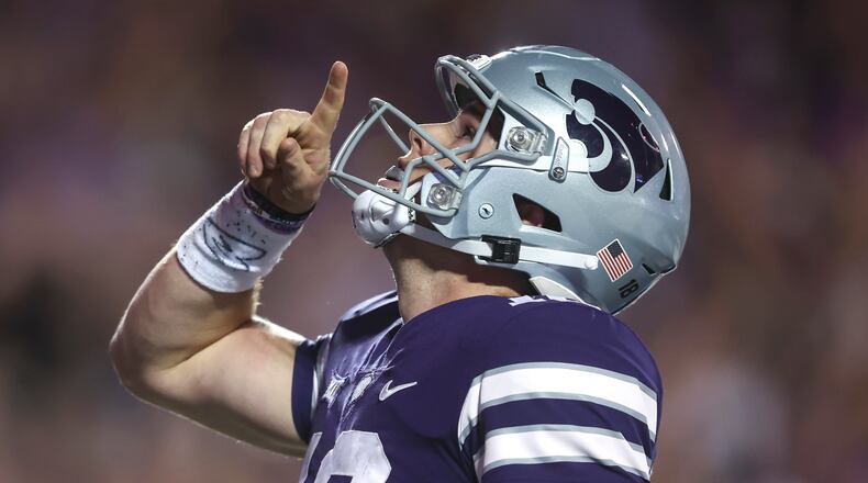 Kansas State quarterback Will Howard celebrates a touchdown during the third quarter of an NCAA college football game against Central Florida on Saturday, Sept. 23, 2023, in Manhattan, Kan. (AP Photo/Travis Heying)