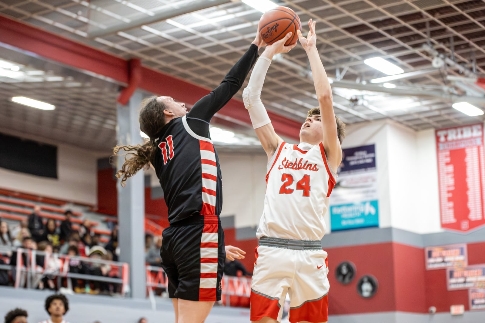 West Carrollton High School senior Daniel Hammond leaps to block the shot of Stebbins senior Zach Cron during their game on Friday, Feb. 13 at Ron Coleman Gymnasium in Riverside. The Pirates won 46-41. MICHAEL COOPER / STAFF