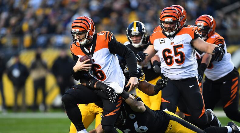 PITTSBURGH, PA - DECEMBER 30: Jeff Driskel #6 of the Cincinnati Bengals is wrapped up for a sack by Anthony Chickillo #56 of the Pittsburgh Steelers in the first quarter during the game at Heinz Field on December 30, 2018 in Pittsburgh, Pennsylvania. (Photo by Joe Sargent/Getty Images)
