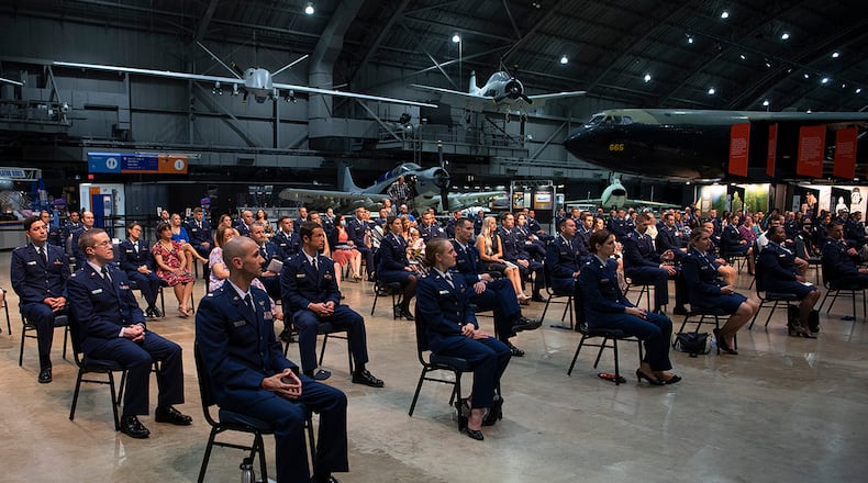 Graduates, program directors and a few select guests listen to Lt. Gen. Dorothy Hogg, the Air Force surgeon general, give the keynote address at the Wright-Patterson Medical and Allied Health Education Programs graduation ceremony May 27 in the National Museum of the U.S. Air Force. More than 70 Air Force officers were recognized for completing their medical residencies in local hospitals, including Wright-Patterson Medical Center and Dayton Veterans Affairs Medical Center. U.S. AIR FORCE PHOTO/R.J. ORIEZ