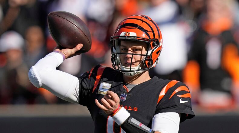 Cincinnati Bengals quarterback Joe Burrow (9) throws a pass against the Houston Texans during the first half of an NFL football game Sunday, Nov. 12, 2023, in Cincinnati. (AP Photo/Carolyn Kaster)