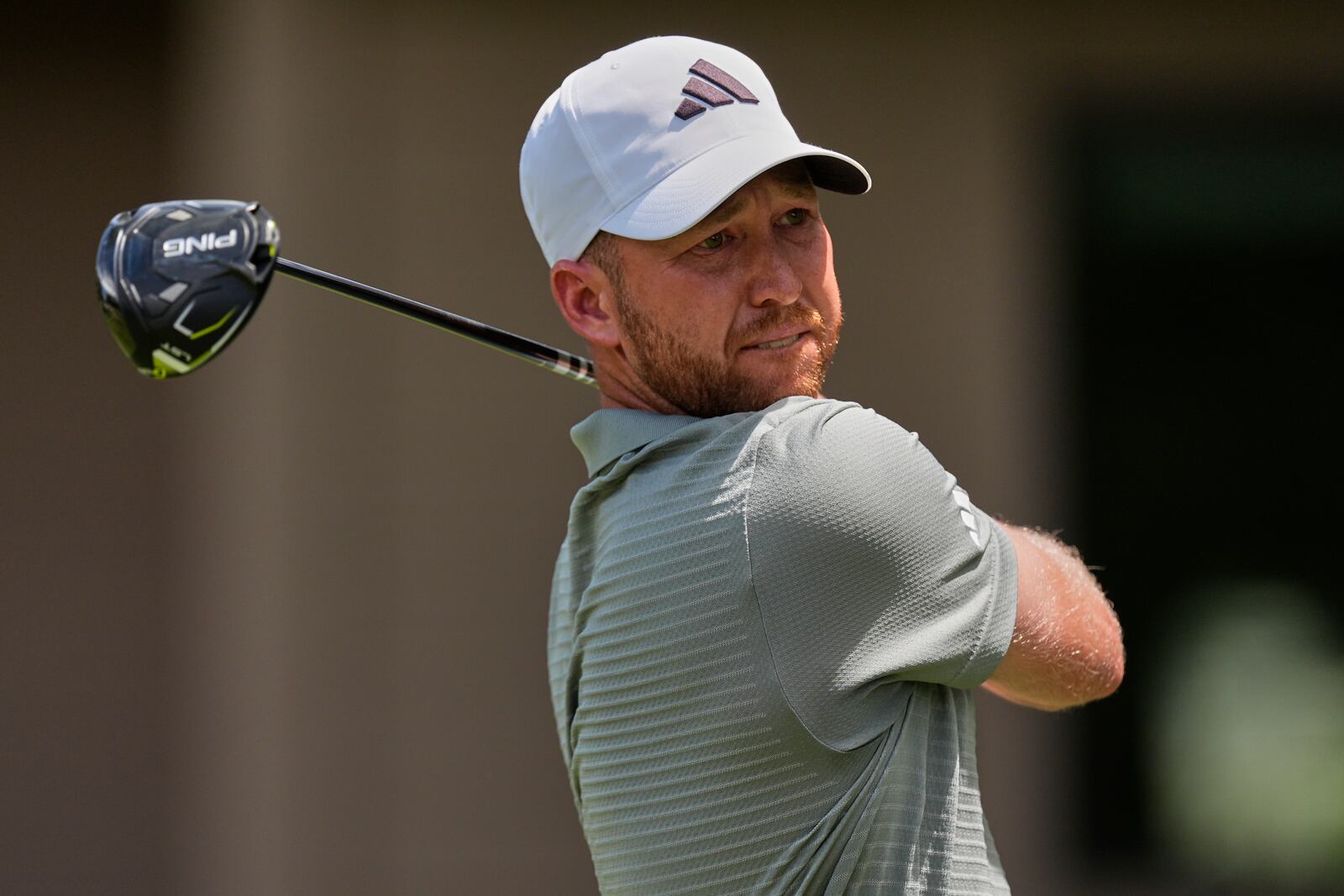 Daniel Berger watches his drive on the third hole during the final round of the RBC Heritage golf tournament, Sunday, April 20, 2025, in Hilton Head Island, S.C. (AP Photo/Mike Stewart)