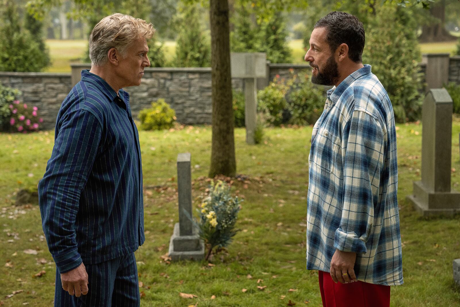 This image released by Netflix shows Christopher McDonald, left, and Adam Sandler in a scene from "Happy Gilmore 2." (Scott Yamano/Netflix via AP)