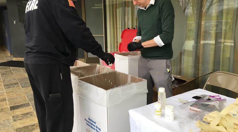 Moraine employees dump out unused pills turned in by residents on National Prescription Drug Take Back Day in 2018, FILE PHOTO