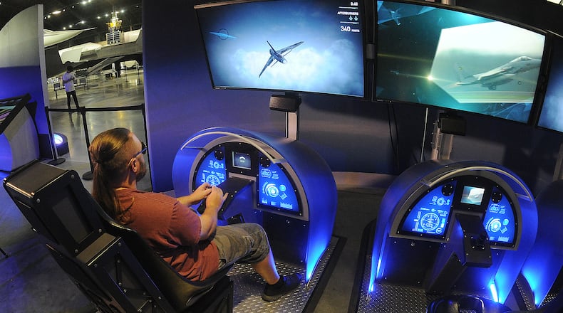 You can design a virtual airplane and fly it on a flight simulation at the "Above and Beyond' exhibit at the National Museum of the U.S. Air Force. MARSHALL GORBY\STAFF