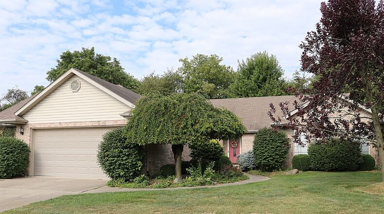 The 3-bedroom, brick ranch has about 1,980 sq. ft. of living space. The 2-car garage includes an elevated storage area and pull-down attic access. CONTRIBUTED PHOTO BY KATHY TYLER