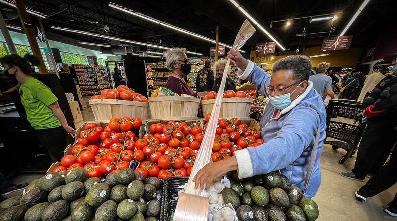 Sheila Jenkins from Trotwood said, "I've been watching it for a year and I wanted to be a part of the opening." Gem City Market on Salem opened its doors at noon Wednesday afternoon May 12, 2021. "Being here says it can be done," she added. JIM NOELKER/STAFF
 JIM NOELKER/STAFF