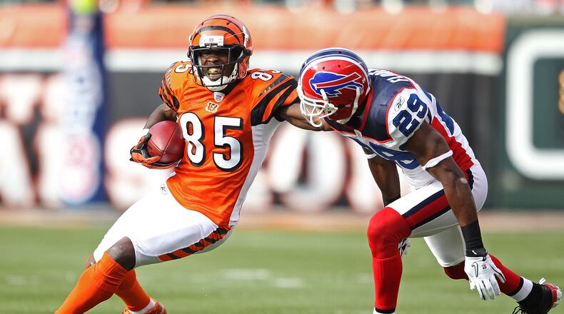 Former Bengals wide receiver Chad Johnson, aka as "Ochocinco," is seen here trying to get past Buffalo defender Drayton Florence in a 2010 game in Paul Brown Stadium.