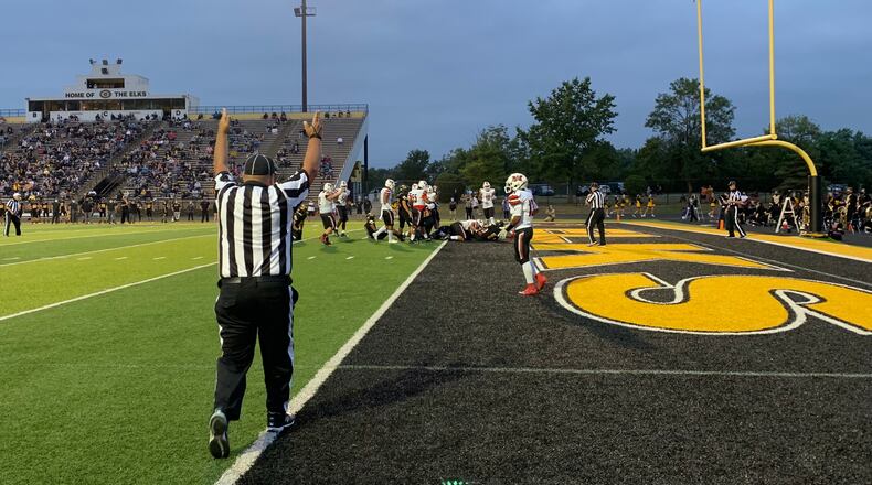 Wayne scores a touchdown during Friday night's game at Centerville. The Warriors won 28-23. Marcus Hartman/STAFF