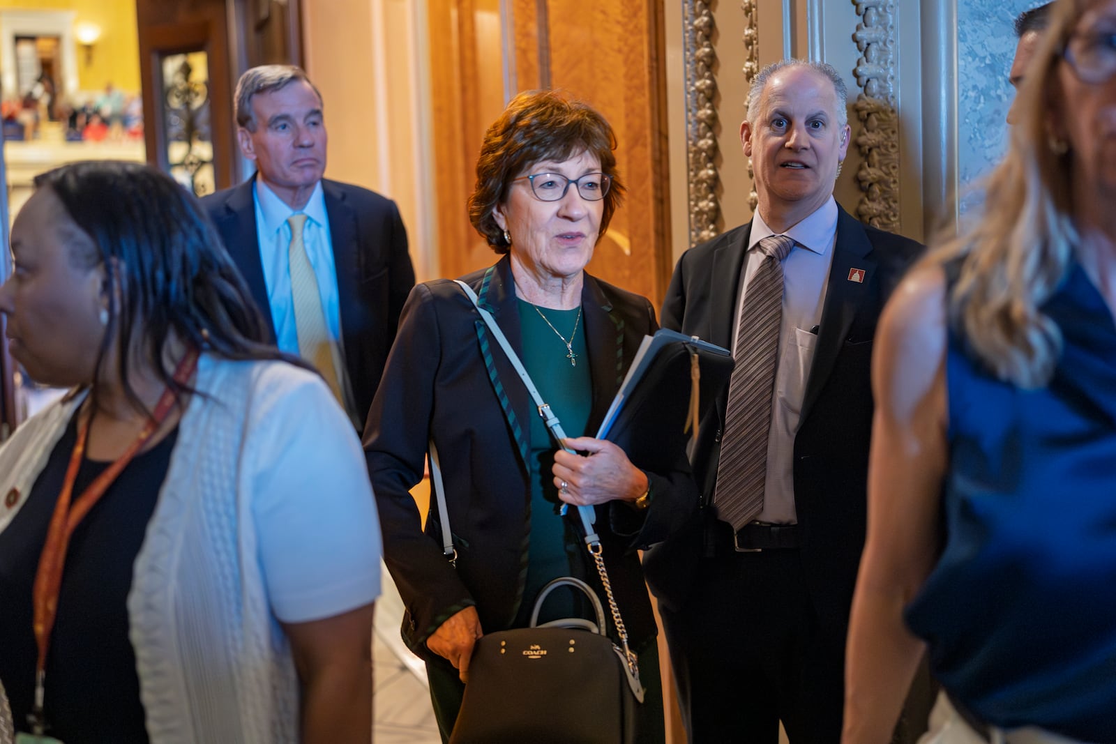 Sen. Susan Collins, R-Maine, departs the chamber as the Senate holds a procedural vote on the nomination of Emil Bove, who served on President Donald Trump's criminal defense team, to be a U.S. Circuit Court judge for the 3rd U.S. Circuit Court of Appeals, at the Capitol in Washington, Thursday, July 24, 2025. (AP Photo/J. Scott Applewhite)