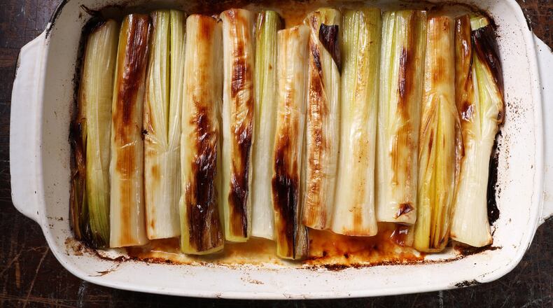 Leeks are roasted at high temperature before being bathed in broth then braised until silky and sweet. (Abel Uribe/Chicago Tribune/TNS)