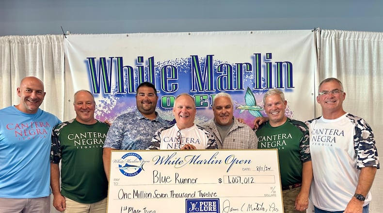 Team Buckeye Tuna – (left to right: Jarrod Keely; Dave Dunton; mate Drew Kegreiss; Rob Jones; Captain Mark DeBlasio; Jamie Greer; Lance Gildner) with their $1,007,000.00 check for winning the tuna division of the White Marlin Open last week In Ocean City Maryland. It is the largest and richest billfish tournament in the world. Their bigeye tuna weighed 220.5 pounds. CONTRIBUTED
