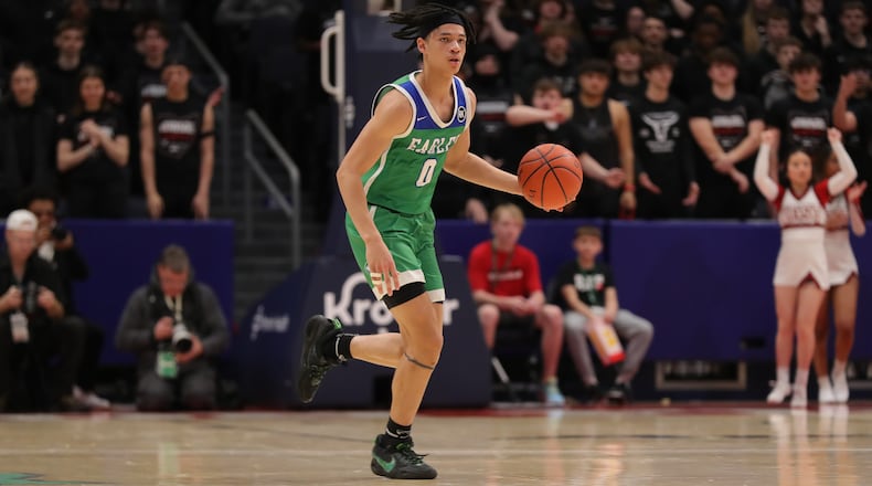 Chaminade Julienne High School senior Evan Dickey dribbles the ball up the floor during a Division II state semifinal game on Friday morning at University of Dayton Arena. CONTRIBUTED BY MICHAEL