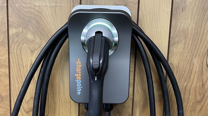 A level 2 charger installed in a garage allows charging to occur overnight at home. CONTRIBUTED