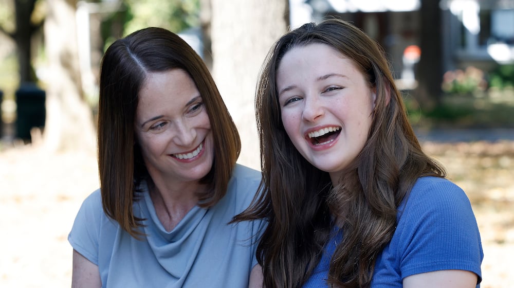 Erin Handler, left, with her daughter, Kay at the Wright Library in Oakwood. MARSHALL GORBY\STAFF