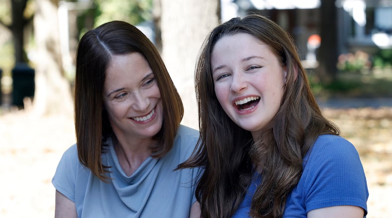 Erin Handler, left, with her daughter, Kay at the Wright Library in Oakwood. MARSHALL GORBY\STAFF