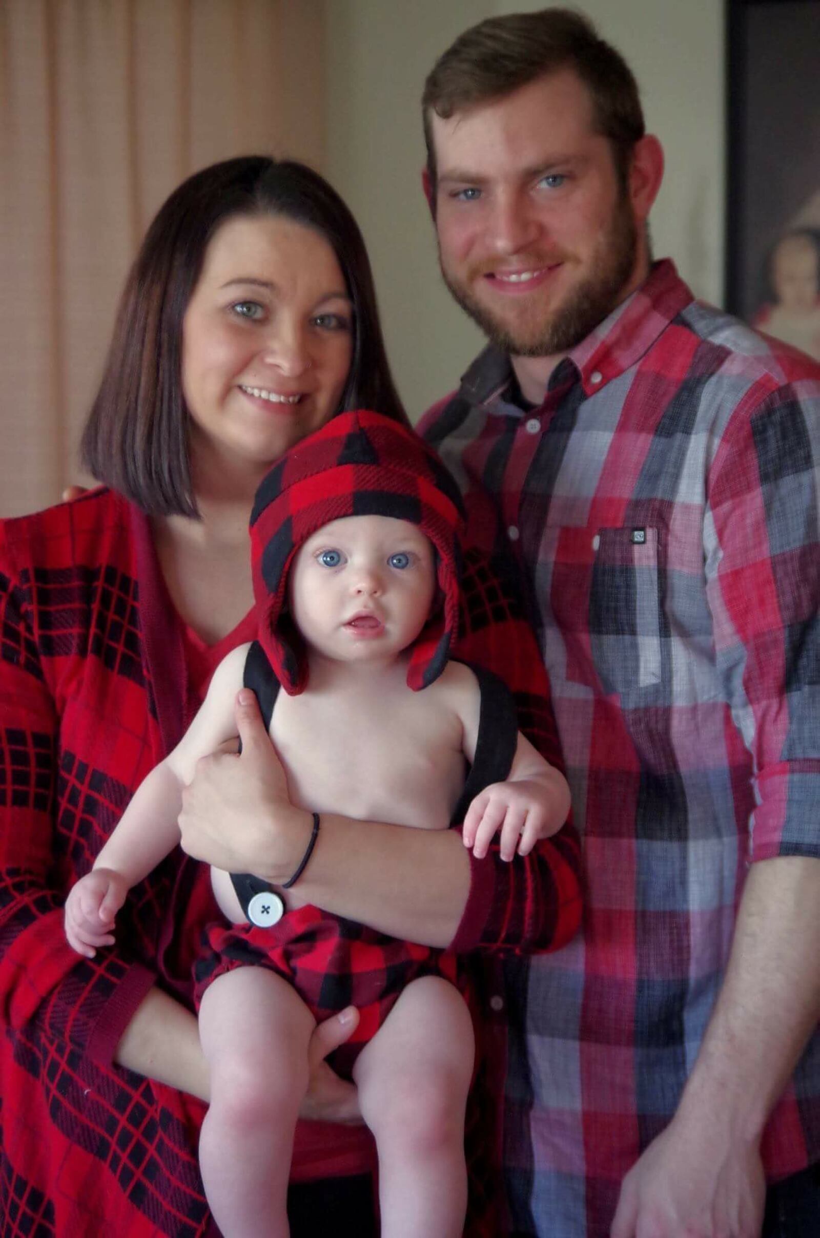 Timothy R. Wood is pictured with  his child and , fiancée. he was killed while walking on US 35.
