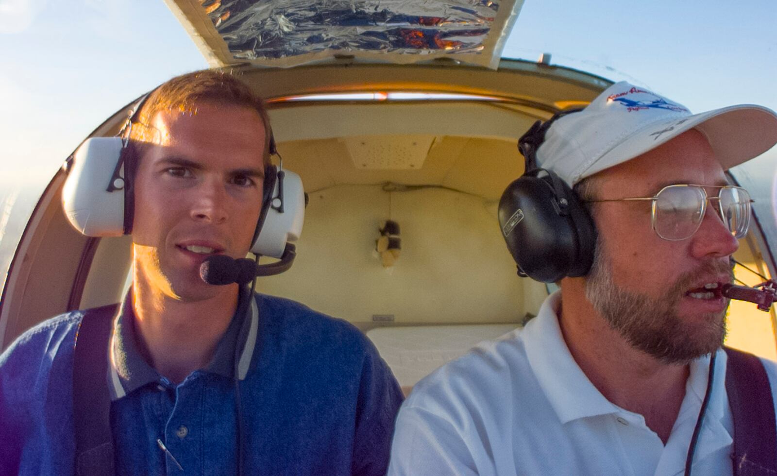 Photographer Ty Greenlees, left, and writer Tim Gaffney, right, somewhere over the U.S. during their Spirit of Flight project in 1997.