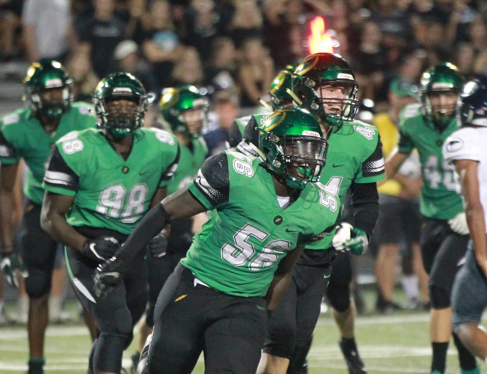 Northmont defenders Phillip Quansah (56) and Shaun Myers (44) celebrate a stop. Northmont defeated visiting Fairmont 28-14 in a Week 3 high school football game on Friday, Sept. 13, 2019. MARC PENDLETON / STAFF